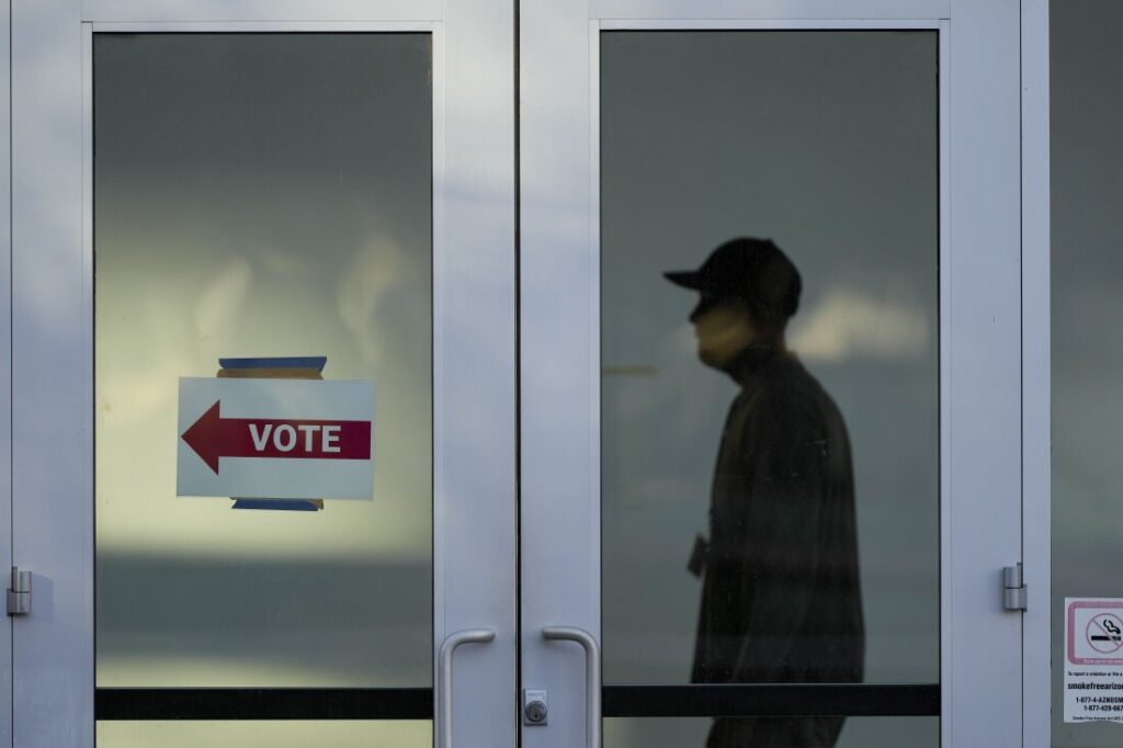 An election worker monitors voting at a polling place on the campus of Arizona State University, Tuesday, Nov. 5, 2024, Phoenix, Ariz.